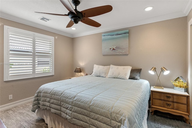 carpeted bedroom featuring ceiling fan and crown molding