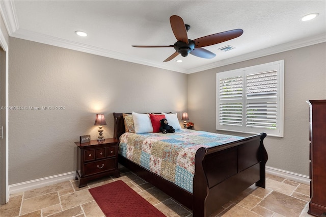 bedroom with ceiling fan and crown molding