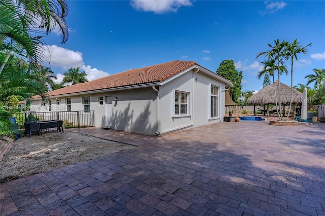 back of house with a patio area