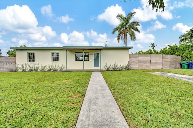 ranch-style house with a front lawn