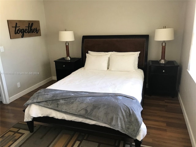 bedroom featuring dark hardwood / wood-style floors