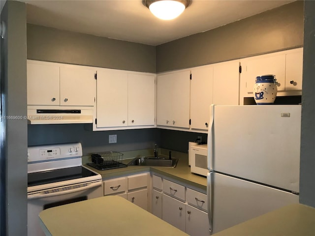 kitchen featuring exhaust hood, white cabinets, and white appliances