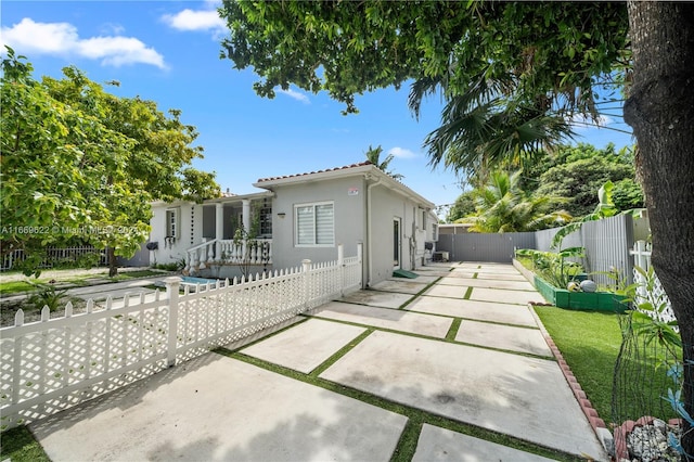 rear view of house with a patio area