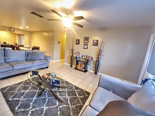 tiled living room featuring ceiling fan