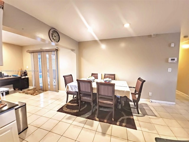 dining space featuring light tile patterned floors