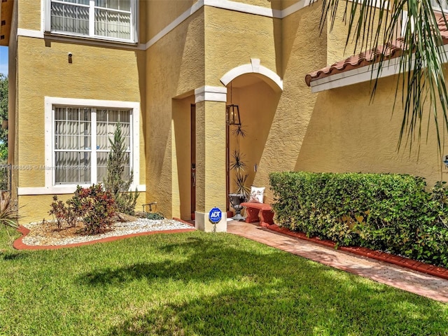 entrance to property with a yard