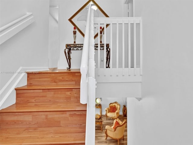 stairs with wood-type flooring