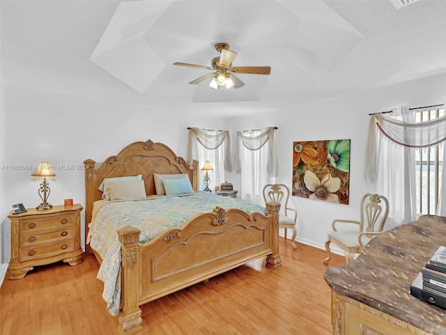 bedroom featuring light wood-type flooring and ceiling fan