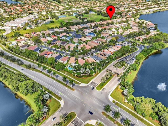 drone / aerial view with a water view