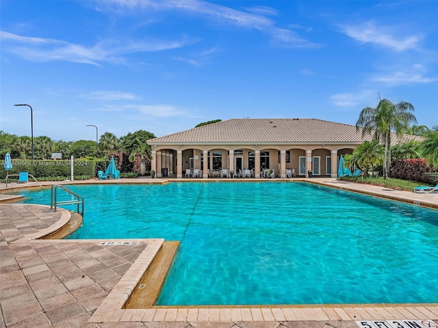 view of swimming pool with a patio area