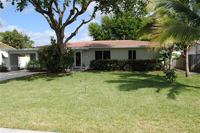 ranch-style house featuring a front lawn