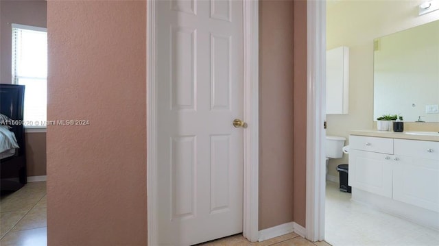 bathroom featuring vanity, toilet, and tile patterned floors