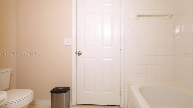 bathroom featuring separate shower and tub and toilet