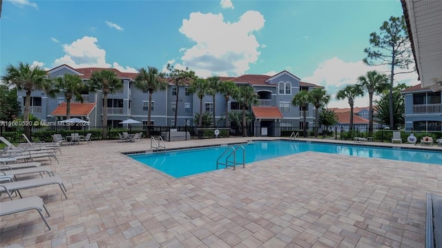 view of swimming pool featuring a patio area