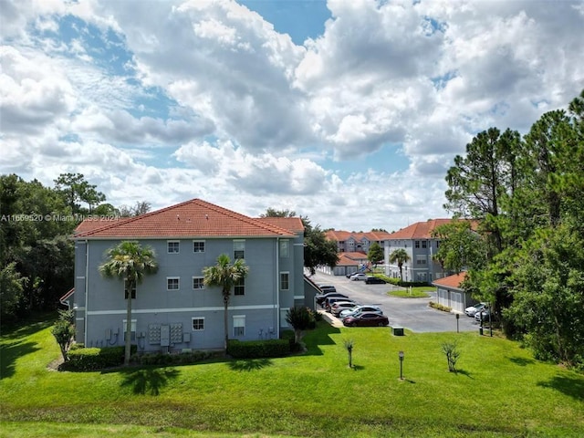 view of home's exterior with a lawn