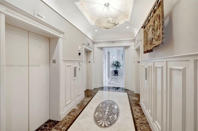 701 Brickell Key Blvd Unit 1108, Miami, FL 33131 - mudroom with elevator, an inviting chandelier, recessed lighting, a decorative wall, and wainscoting