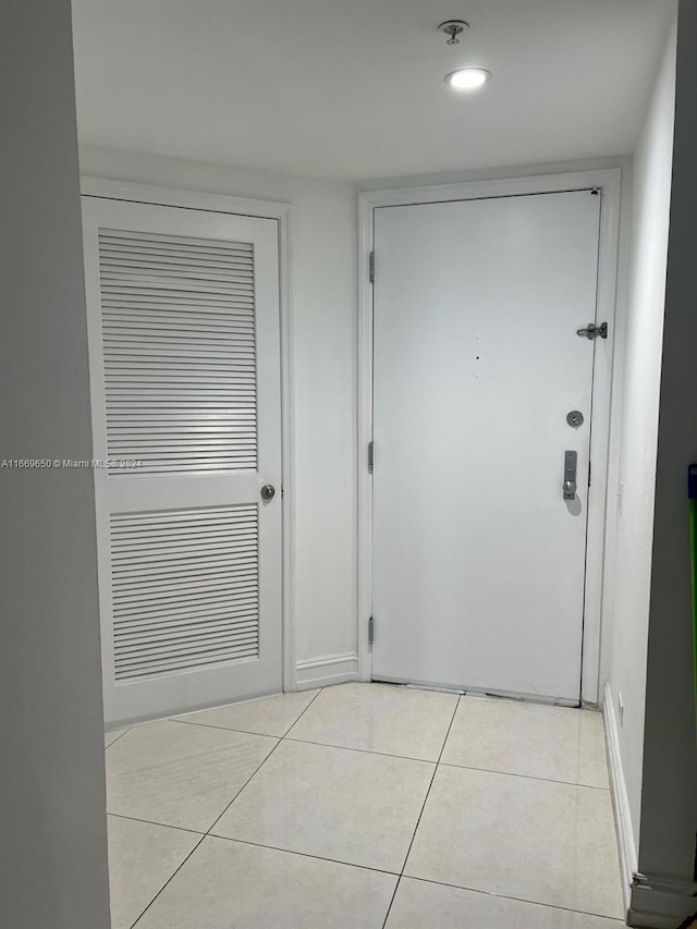 doorway featuring light tile patterned floors