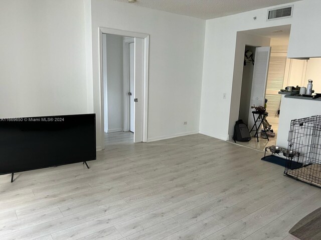 701 Brickell Key Blvd Unit 1108, Miami, FL 33131 - living room with visible vents, wood finished floors, and baseboards