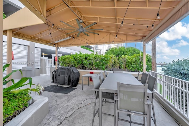 view of patio with area for grilling and ceiling fan