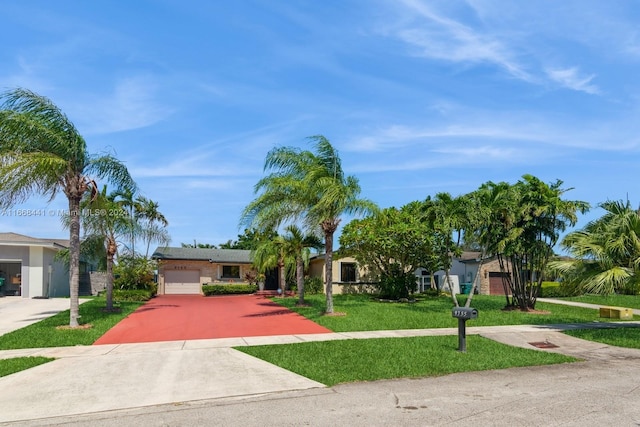 view of front facade featuring a garage and a front lawn