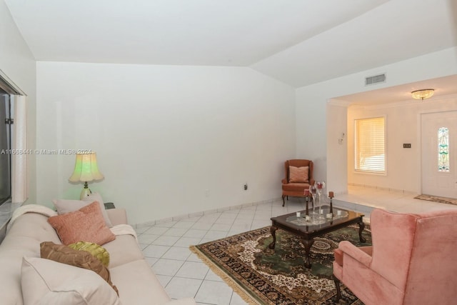 living room featuring light tile patterned flooring and vaulted ceiling