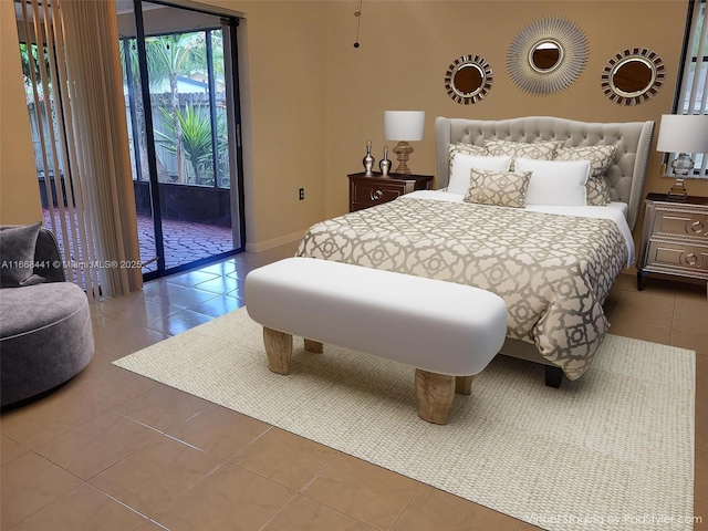 bedroom featuring tile patterned floors, baseboards, and access to exterior