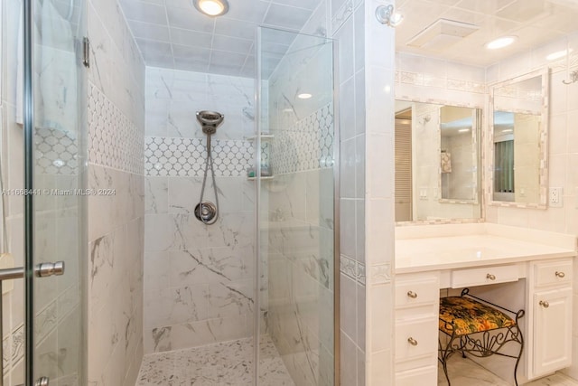 bathroom featuring vanity and an enclosed shower