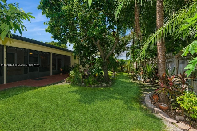 view of yard featuring a patio area and fence