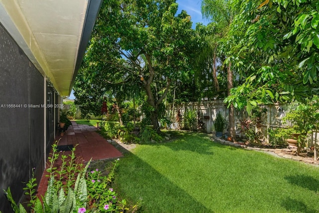 view of yard featuring a patio and a fenced backyard