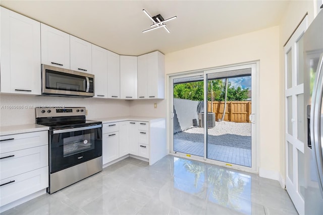 kitchen with white cabinetry and stainless steel appliances