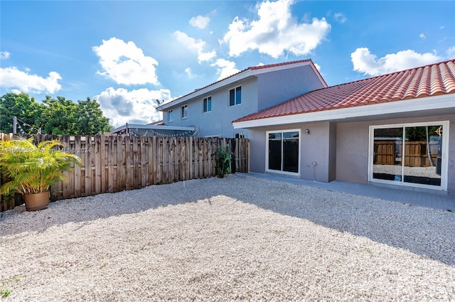 back of house with a patio area