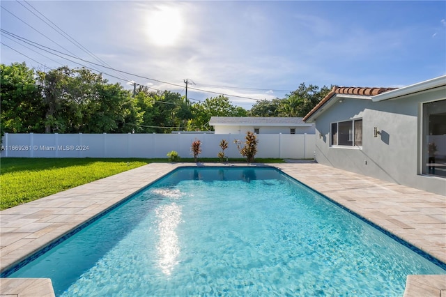 view of swimming pool with a patio