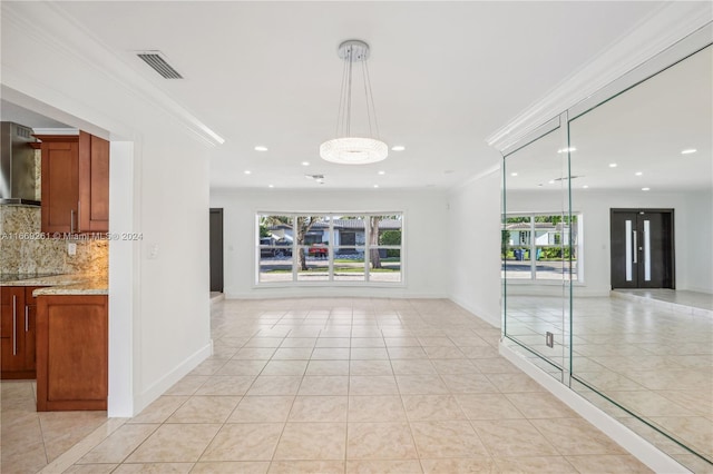 interior space with crown molding