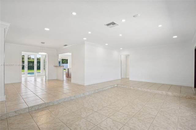 unfurnished room featuring light tile patterned floors and crown molding