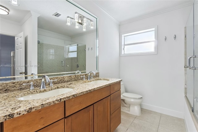 bathroom featuring vanity, a shower with shower door, toilet, and crown molding