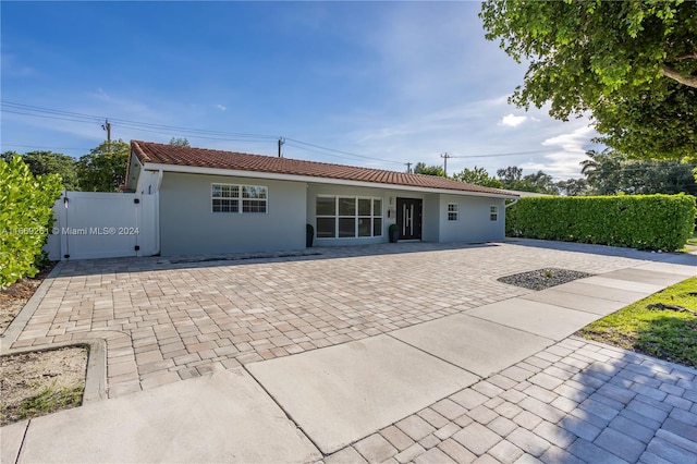 rear view of house featuring a patio