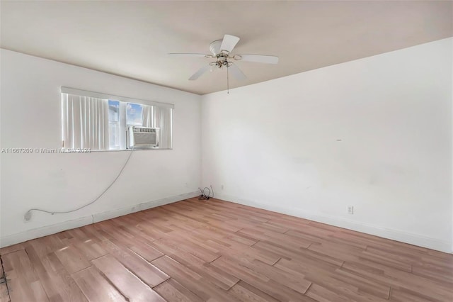 unfurnished room featuring ceiling fan and light hardwood / wood-style floors