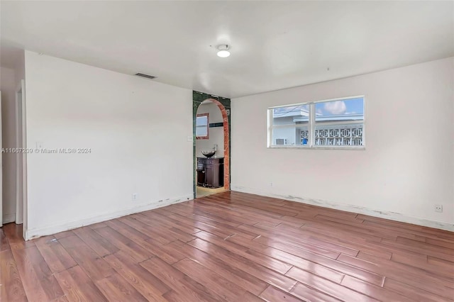 unfurnished room featuring light hardwood / wood-style flooring