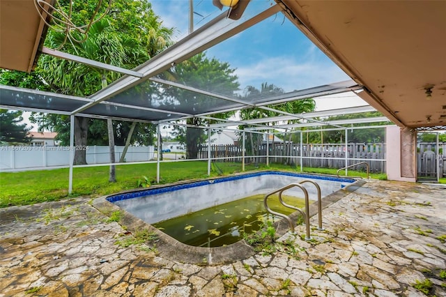 view of pool with a lanai and a patio