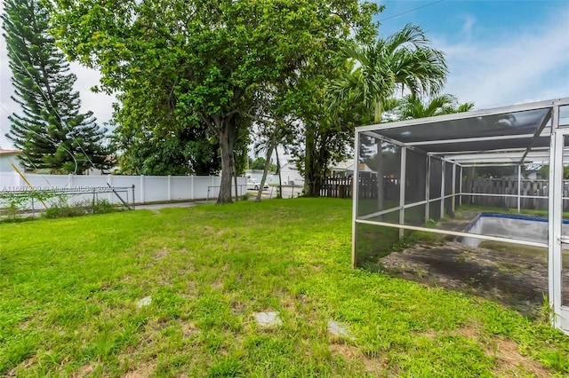 view of yard with a lanai