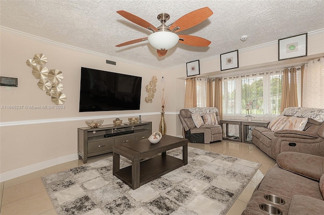 tiled living room featuring ornamental molding, a textured ceiling, and ceiling fan