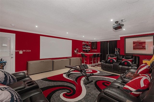 tiled cinema featuring ornamental molding, indoor bar, and a textured ceiling