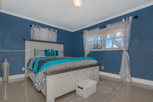 bedroom featuring a textured ceiling and crown molding