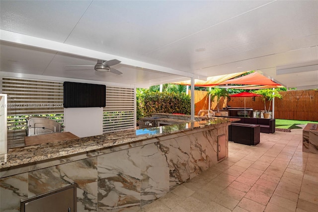 view of patio featuring ceiling fan