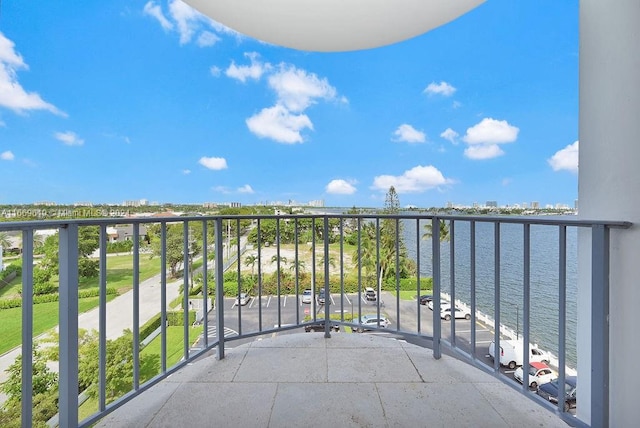 balcony featuring a water view