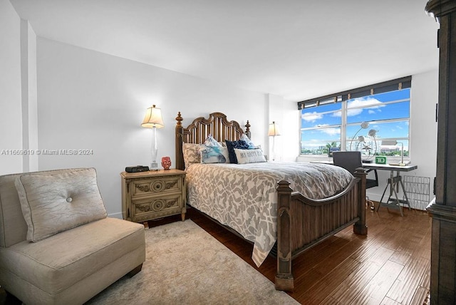 bedroom with hardwood / wood-style flooring