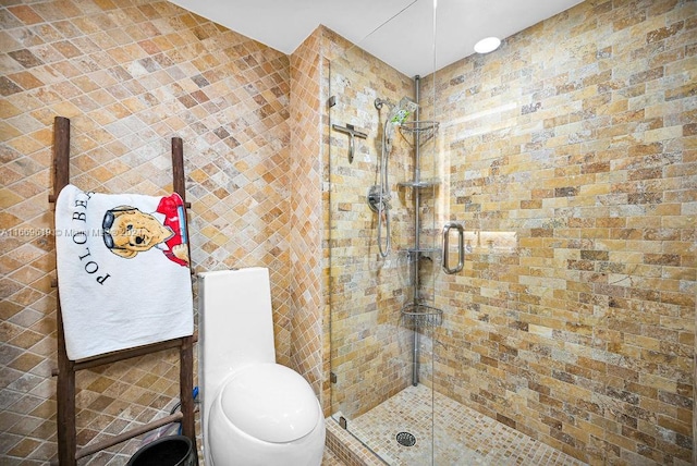 bathroom featuring walk in shower and toilet