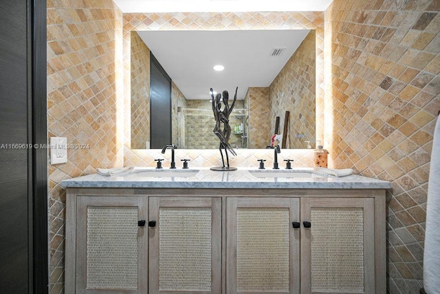 bathroom with tile walls, backsplash, and vanity