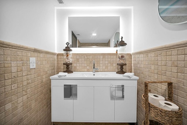 interior space with tile walls and vanity