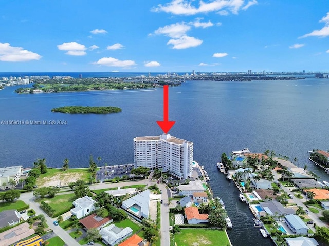 birds eye view of property with a water view